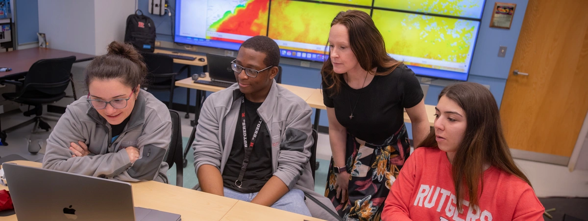 (l to r) Lab researcher Julia Engdahl; graduate fellow Teemer Barry; associate professor Grace Saba, Department of Marine and Coastal Sciences; and PhD candidate Samantha Alaimo (SEBS '26) observe data in the RU Center for Ocean Observing Leadership, RU COOL, Operations Center.
